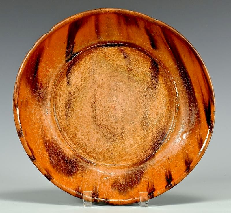 Appraisal: Earthenware Manganese Decorated Charger Mid Atlantic or Southern redware plate