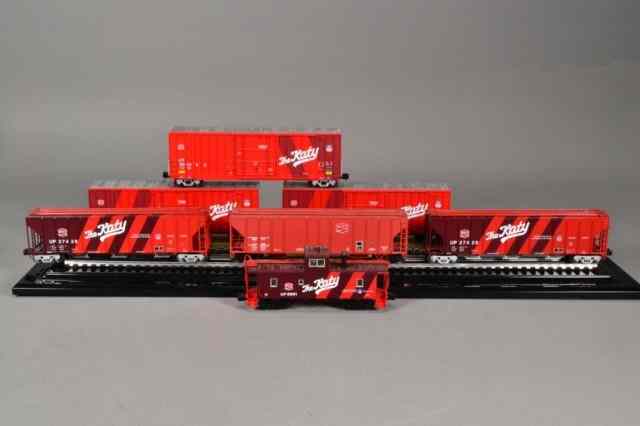 Appraisal: LIONEL THE KATY BOX CARS CABOOSEIncluding six red and maroon