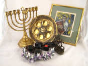 Appraisal: Judaica A brass Seder plate two brass menorahs four phyllactera