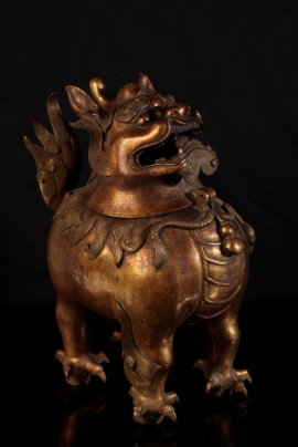 Appraisal: A CHINESE GILT BRONZE LION INCENSE-BURNER with a detachable head