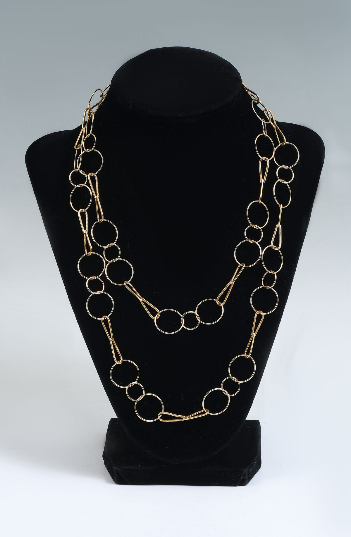 Appraisal: '' K CIRCLE AND BOWTIE LINK NECKLACE This circle and