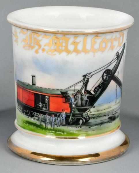 Appraisal: Steam-Powered Railway Shovel Shaving Mug Description Gilt name K Milford