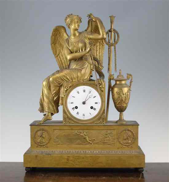 Appraisal: A French Empire ormolu mantel clock surmounted with a figure