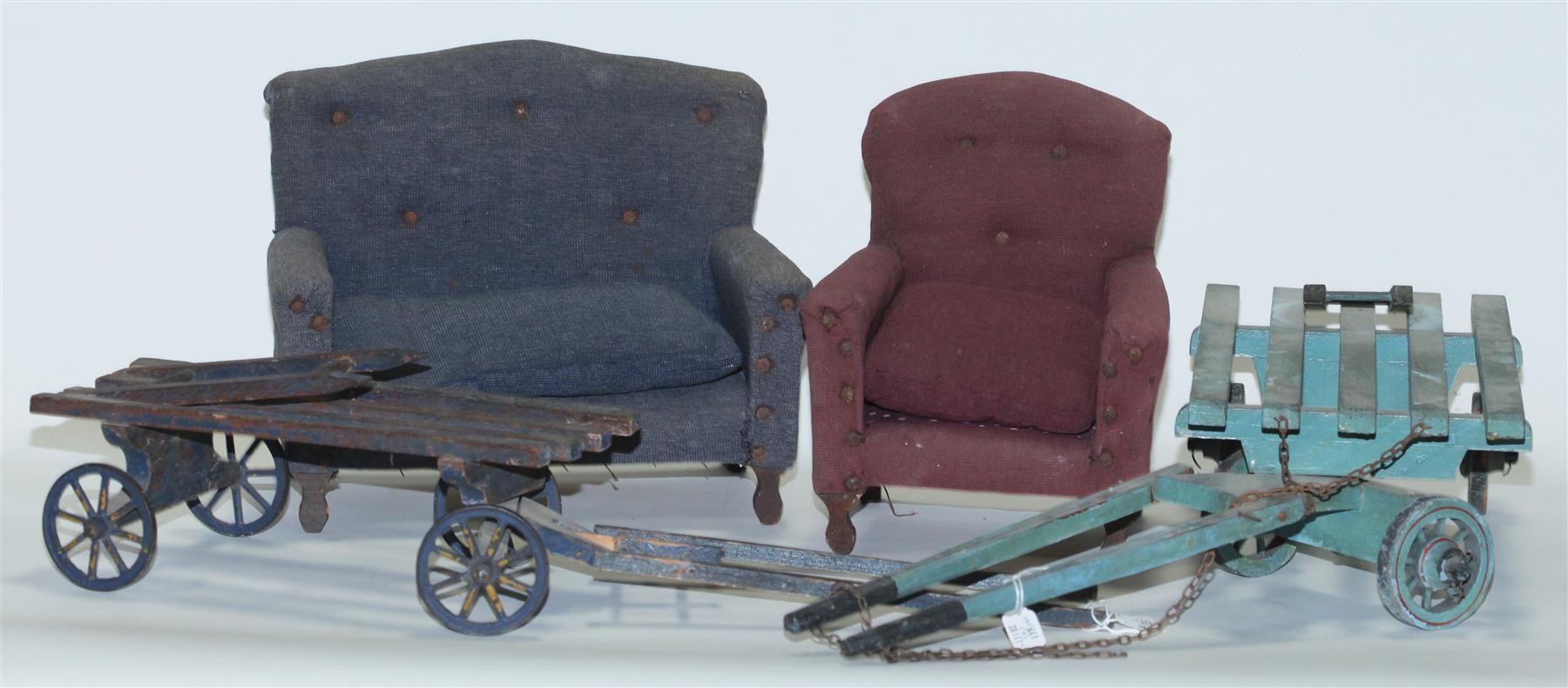 Appraisal: FOUR MINIATURE PIECES American th century Two toy hay wagons