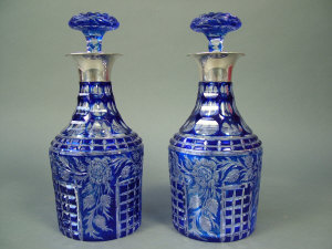 Appraisal: A pair of George V blue flash overlay decanters stoppers