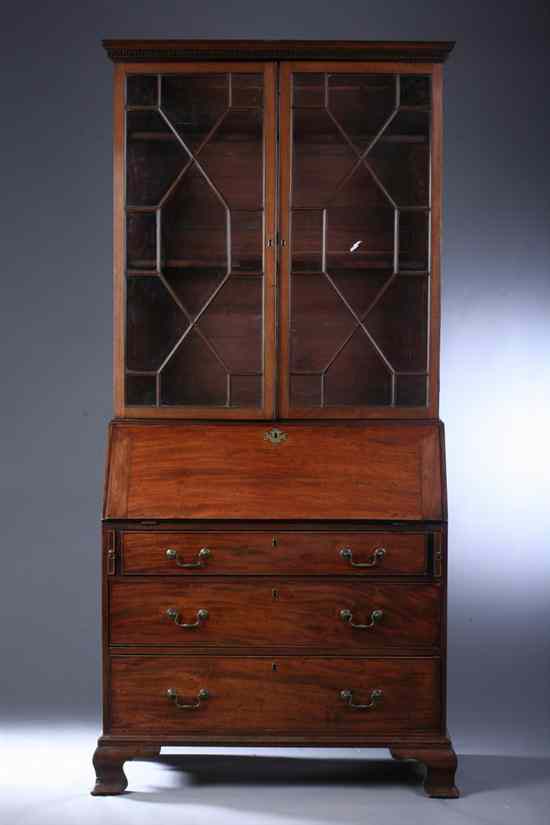 Appraisal: GEORGIAN MAHOGANY SLANT-FRONT SECRETARY BOOKCASE th century in two sections