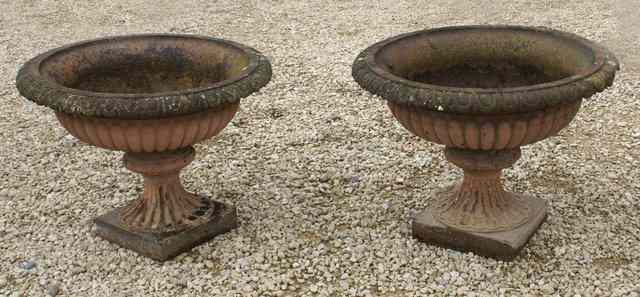 Appraisal: A PAIR OF VICTORIAN PAINTED CAST IRON GARDEN URNS of