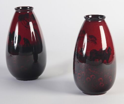 Appraisal: A pair of Royal Doulton flamb vases of swollen tapering