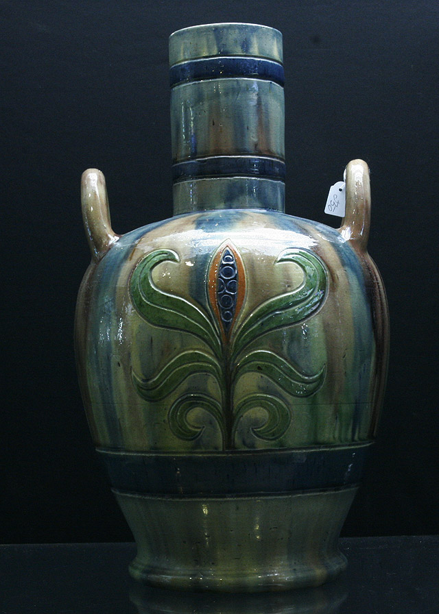 Appraisal: A Belgian glazed pottery baluster shaped vase cms high