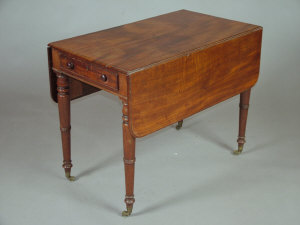 Appraisal: A Victorian mahogany pembroke table the moulded top with end