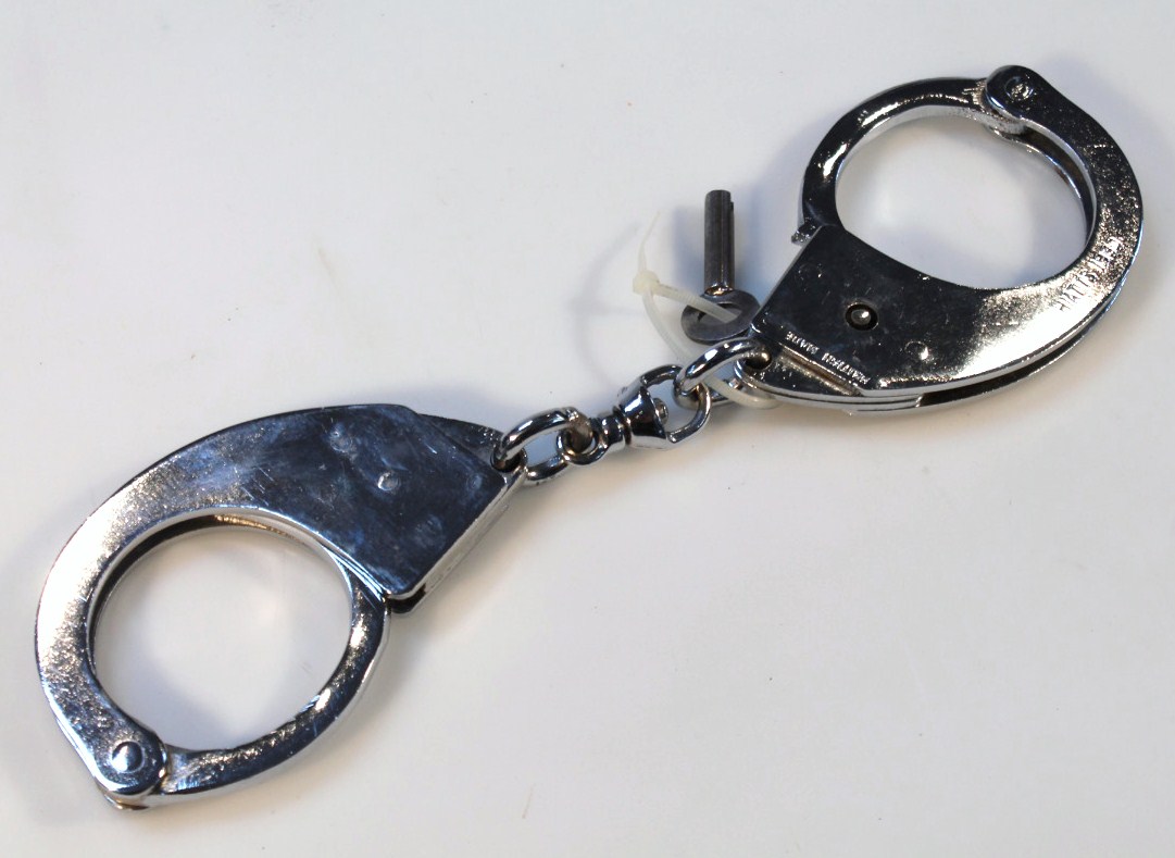 Appraisal: A pair of thC British Hiatts handcuffs chrome metal stamped