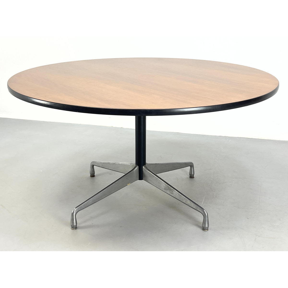 Appraisal: Herman Miller Eames walnut round table Aluminum group Labeled Dimensions