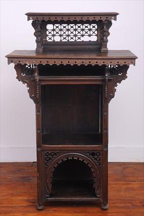 Appraisal: MOORISH-STYLE CARVED HARDWOOD CABINET The molded rectangular shelf over spindle