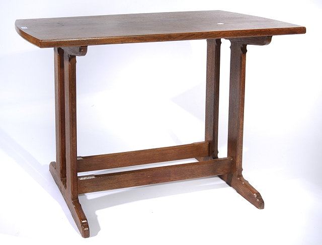 Appraisal: A COTSWOLD SCHOOL ARTS AND CRAFTS STYLE OAK CENTRE TABLE