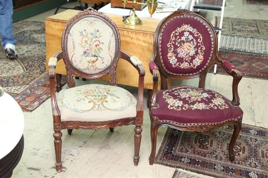 Appraisal: TWO ARMCHAIRS Similar French style chairs with carved features and