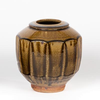 Appraisal: Phil Rogers British born a globular cutsided pot brown glaze