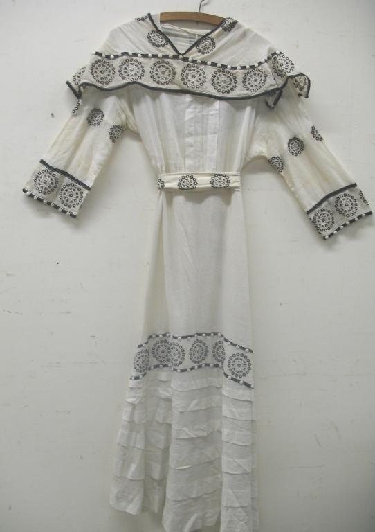 Appraisal: An early th century full length cream dress decorated with