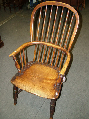 Appraisal: An ash and elm Windsor armchair the spindle turned back