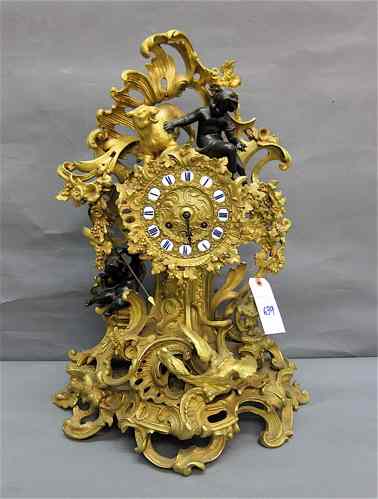 Appraisal: LOUIS XV STYLE BRONZE MANTEL CLOCK French th century featuring