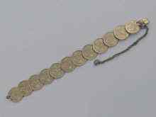 Appraisal: A Russian silver bracelet made up from Russian coins each