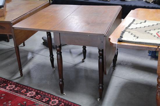 Appraisal: DROP LEAF TABLE Walnut having rectangular leaves with rounded corners