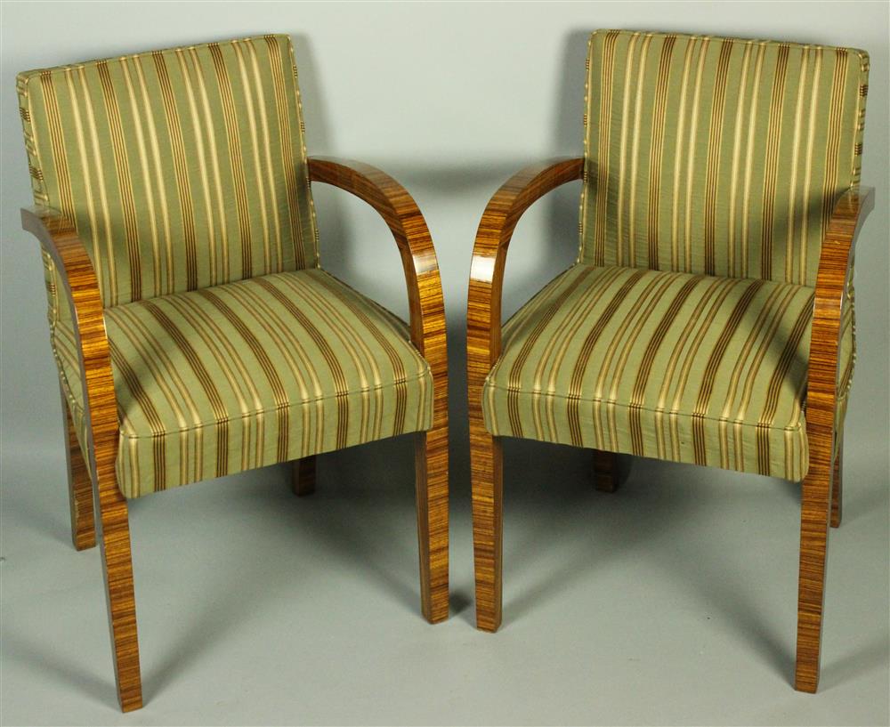 Appraisal: PAIR OF ART DECO UPHOLSTERED ARM CHAIRS having an upholstered