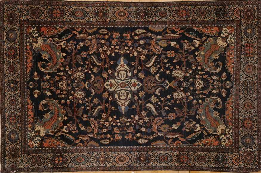 Appraisal: NORTHWEST PERSIAN COBALT-GROUND RUG The small ivory medallion anchored to