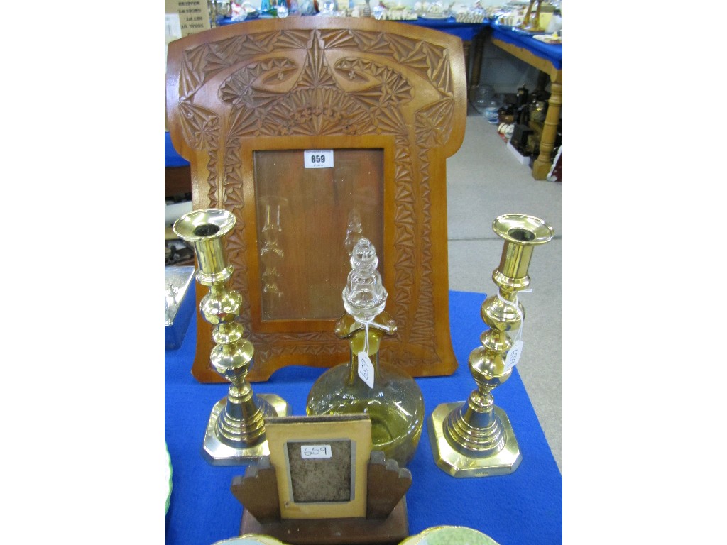 Appraisal: Lot comprising carved wooden photograph frame pair of brass candlesticks