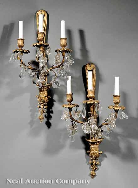 Appraisal: A Pair of Bronze and Crystal Three-Light Sconces E F