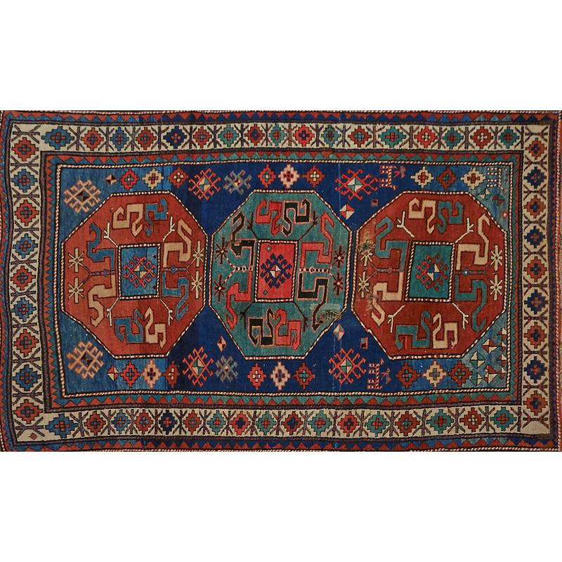 Appraisal: PERSIAN KAZAK AREA RUG Red and blue medallions with geometric