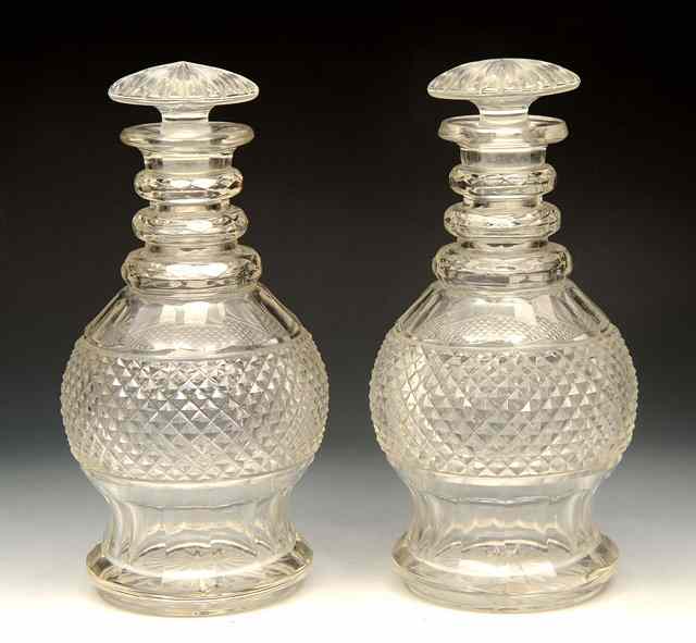 Appraisal: A PAIR OF IRISH CUT GLASS DECANTERS with hobnail decoration