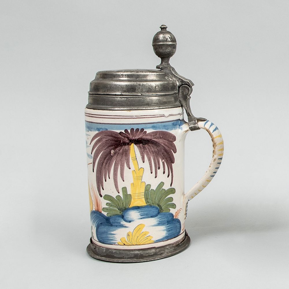 Appraisal: Pewter-Mounted German Fayence Tankard Unmarked with two paper rondels '