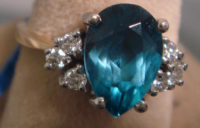 Appraisal: kK YG blue topaz and diamond ring pear shaped carat