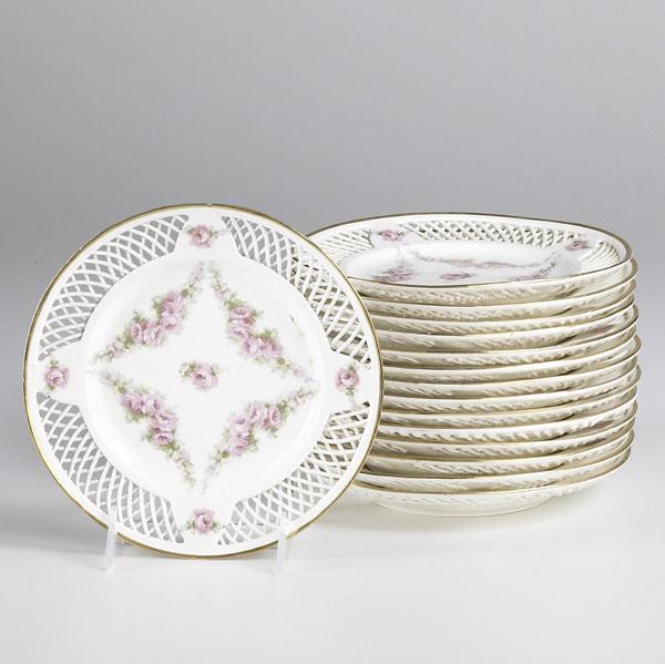 Appraisal: HANDPAINTED PORCELAIN PLATES Gold rimmed with roses and reticulated borders