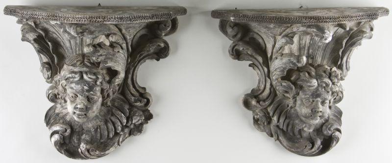 Appraisal: Pair of Cupid Form Wall Brackets composition material with a