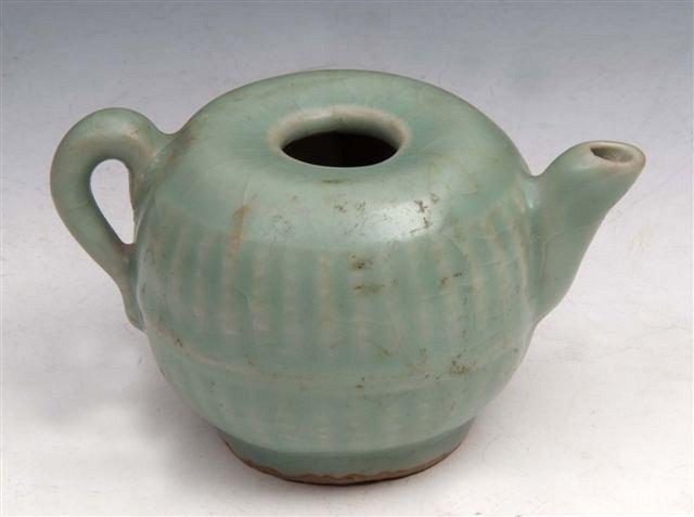 Appraisal: A CHINESE SUNG DYNASTY PORCELLANOUS WINE POT of fluted globular