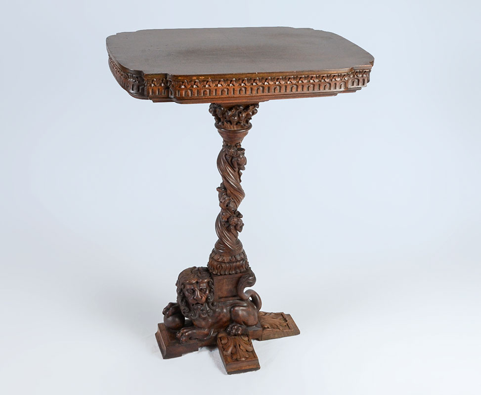 Appraisal: RENAISSANCE REVIVAL CARVED CHERUB SIDE TABLE th century shaped top