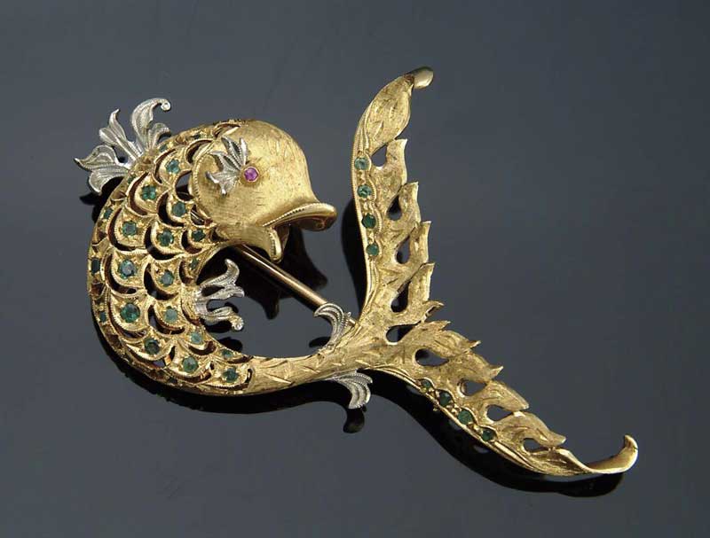 Appraisal: K GOLD RUBY AND EMERALD FISH MOTIF BROOCH Fish set