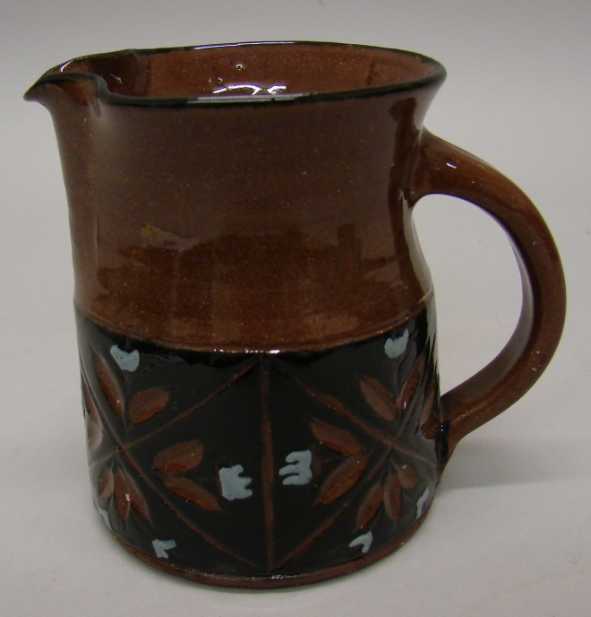 Appraisal: Creamer - Brown black slip with design WOOD CUT XMAS