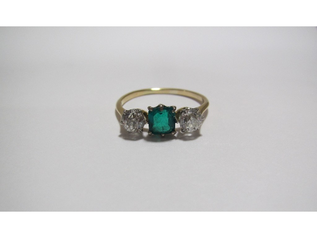 Appraisal: An Edwardian ct gold emerald and diamond three stone ring