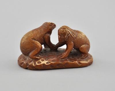 Appraisal: A Carved Kappa Boy and Frog Ivory Netsuke Depicting Kappa