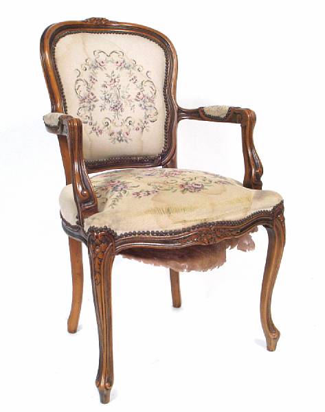 Appraisal: A Louis XV style mixed wood fauteuil height in width