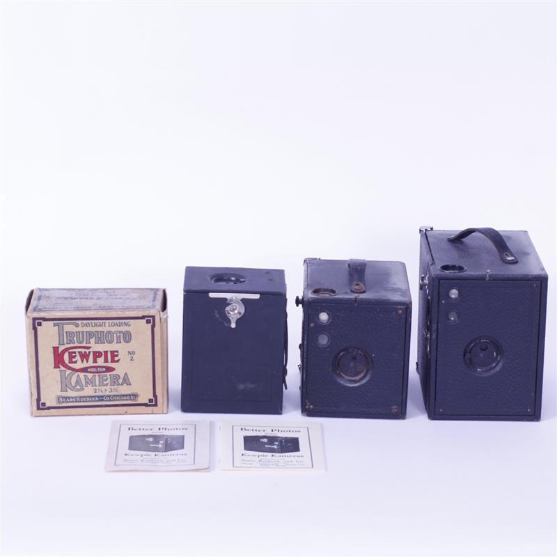 Appraisal: Four Kewpie Cameras Kewpie Truphoto Kamera Roll Film in Box