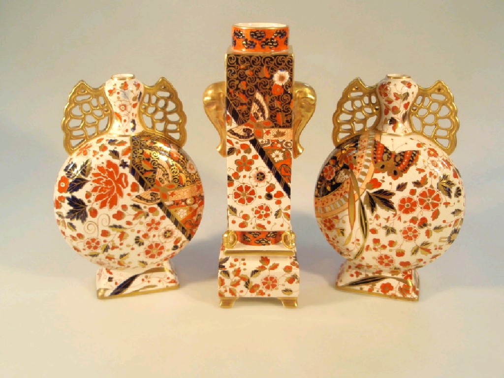 Appraisal: A garniture of Imari pattern vases with central square sectioned