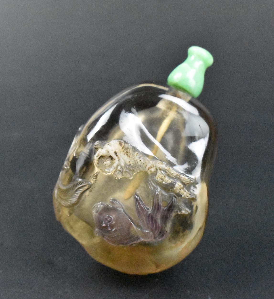 Appraisal: A smoky quartz snuff bottle with goldfish dating from the