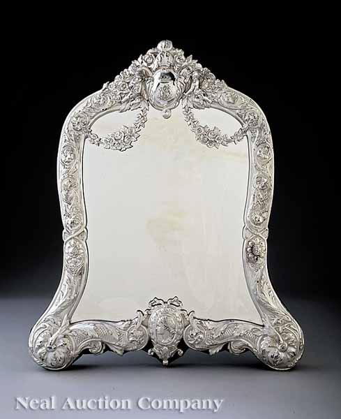 Appraisal: An Impressive Rococo-Style Silverplate Dressing Mirror monogrammed cartouche crest flanked