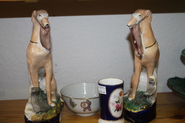 Appraisal: A PAIR OF VICTORIAN POTTERY MODELS OF GREYHOUNDS each with