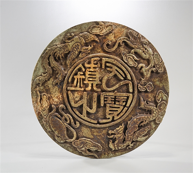 Appraisal: Chinese carved hardstone disc with characters flanked by dragon bat