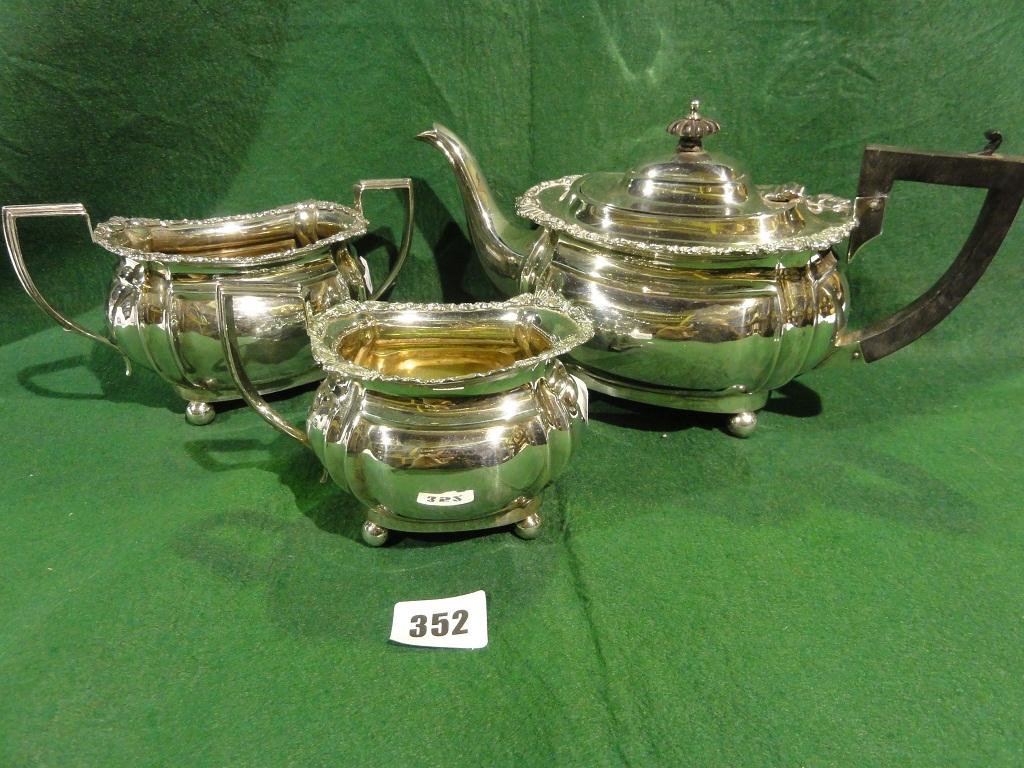 Appraisal: A Georgian style three piece silver tea set comprising teapot