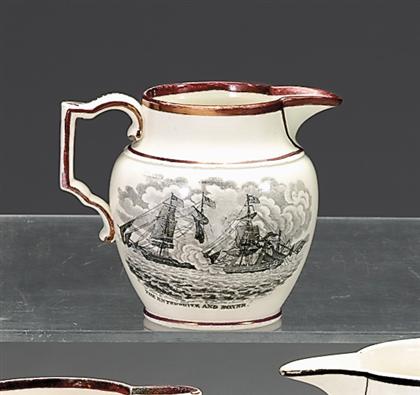 Appraisal: Black transfer printed and pink lustre creamer Decorated with The